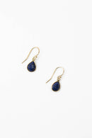 Handcrafted Teardrop Lapis Bezel Earrings on a white background, highlighting the rich blue lapis stones and elegant gold bezels.