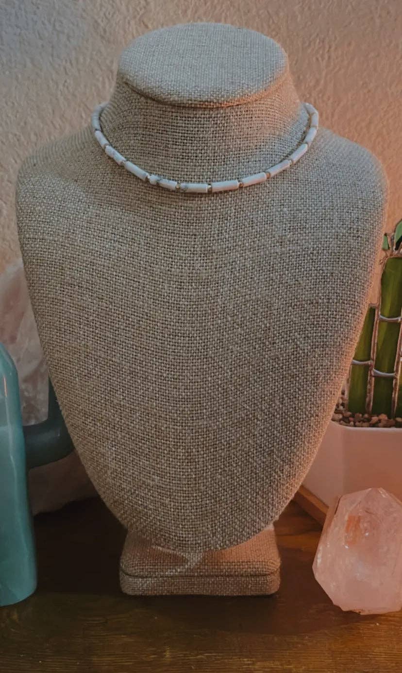 Howlite Choker Necklace displayed on a beige mannequin bust, highlighting the minimalist design and adjustable length.