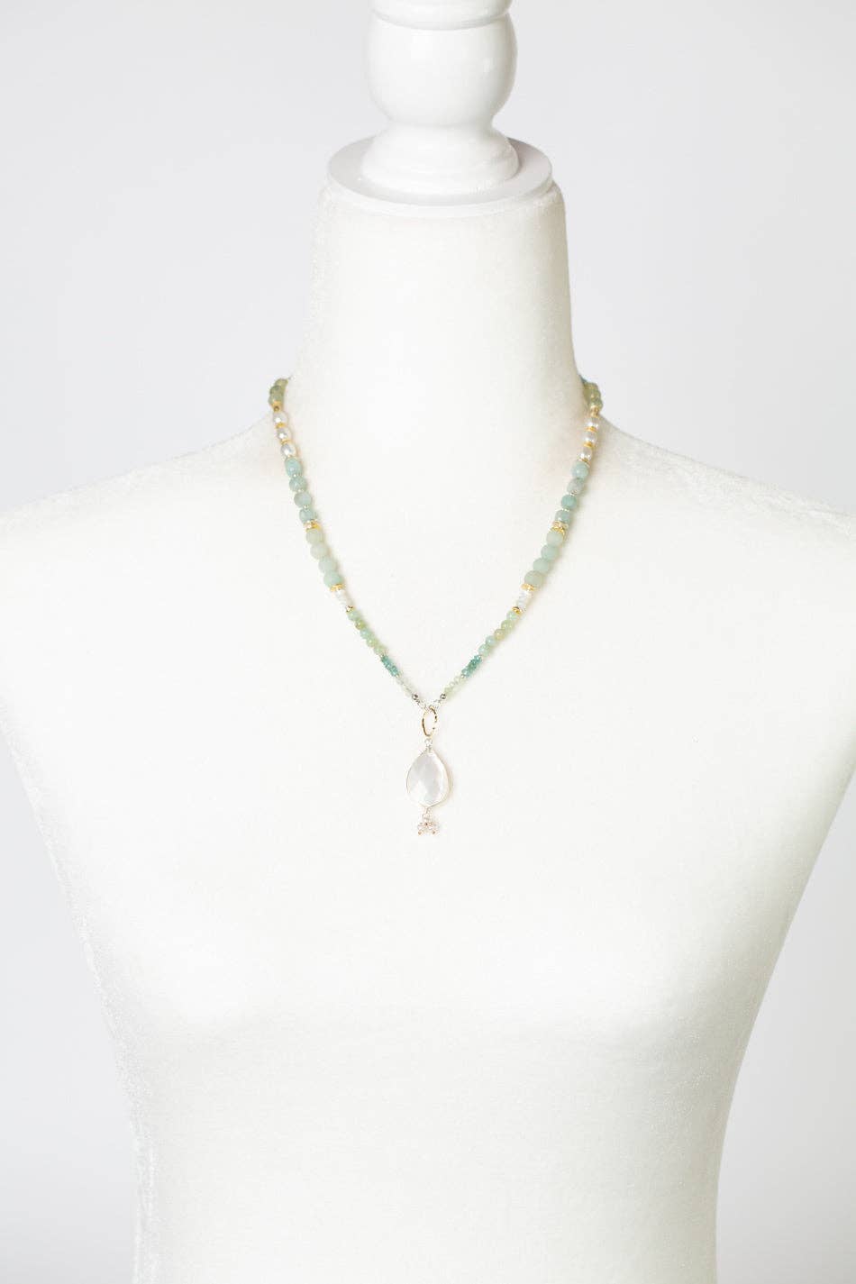 The Freshwater Pearl, Amazonite, and Blue Apatite Necklace displayed on a white mannequin, highlighting its adjustable 18.5-20.5 inch length and elegant design.