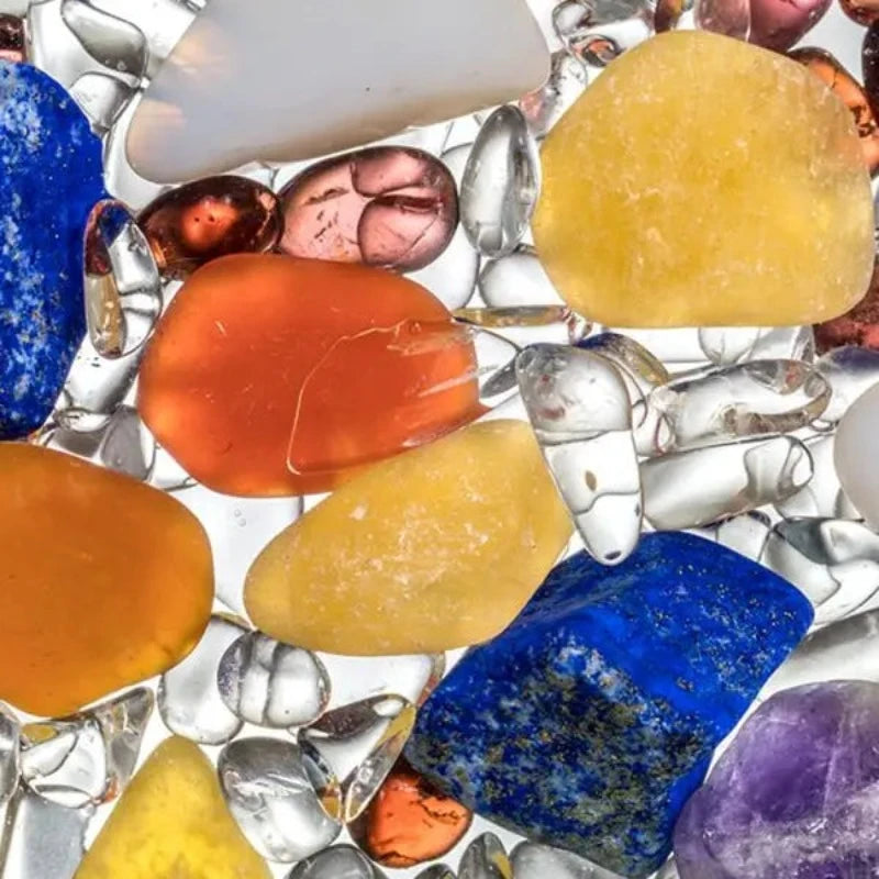 Close-up view of the Ayurveda gemstones including milk opal, amethyst, clear quartz, lapis lazuli, garnet, carnelian, and orange calcite.