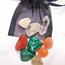 Cancer-themed crystal medicine pouch with Moonstone, Malachite, Carnelian, and Clear Quartz in a black organdy pouch.