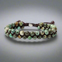 Front view of a double row, adjustable, beaded African Turquoise Bracelet