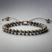 Front view of an adjustable black jasper beaded bracelet