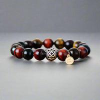 Front view of an a red tiger eye beaded bracelet with a Buddha charm