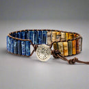 Back view of Warrior Jasper Bracelet featuring multicolored, rectangle gemstones with leather accents