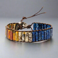 Front view of Warrior Jasper Bracelet featuring multicolored, rectangle gemstones with leather accents