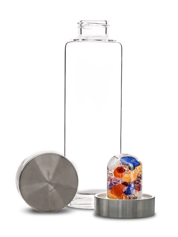 Disassembled view of the ViA Ayurveda Gemstone Water Bottle showing the removable GemPod base with Milk Opal, Amethyst, Clear Quartz, Lapis Lazuli, Garnet, Carnelian, and Orange Calcite.