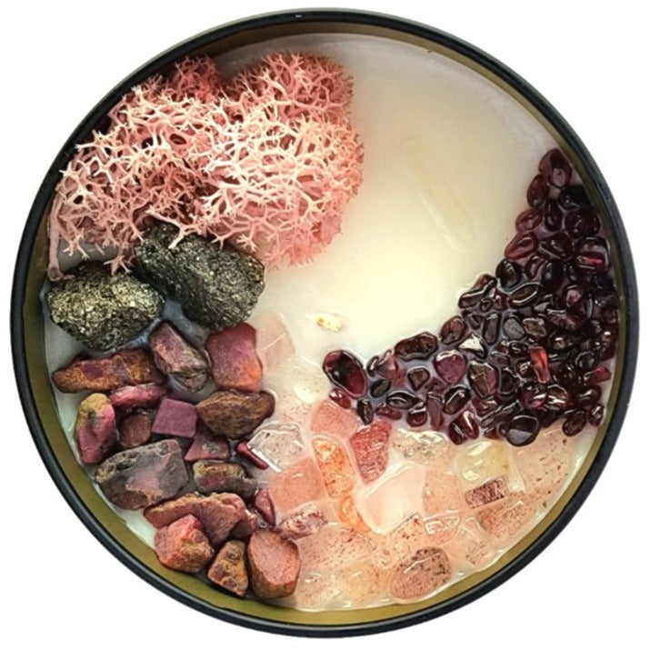 Top view of the 8oz Soy Crystal Intention Candle Beating Heart with Pyrite, Ruby, Strawberry Quartz, and Garnet crystals, scented with Black Pepper and Buttercream.