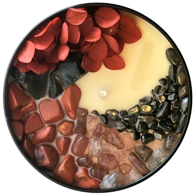 Top view of the 8oz Soy Crystal Intention Candle Blood Moon with Obsidian, Red Jasper, Strawberry Quartz, and Hematite crystals. Scented with Tobacco and Blood Orange.