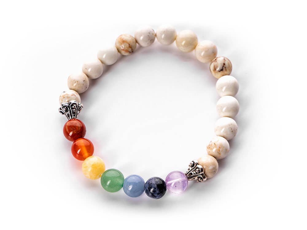 Top view of the Howlite and Chakra Stone Bracelet showcasing its intricate design with 8mm beads and colorful chakra stones for emotional balance and inner peace.