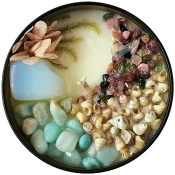 Top view of the 8oz Soy Crystal Intention Candle Niad (Ballad of a Sea Nymph) with Opalite, Amazonite, Trochus Shells, and Mixed Tourmaline crystals. Scented with Sea Salt, Citrus, and Mint.