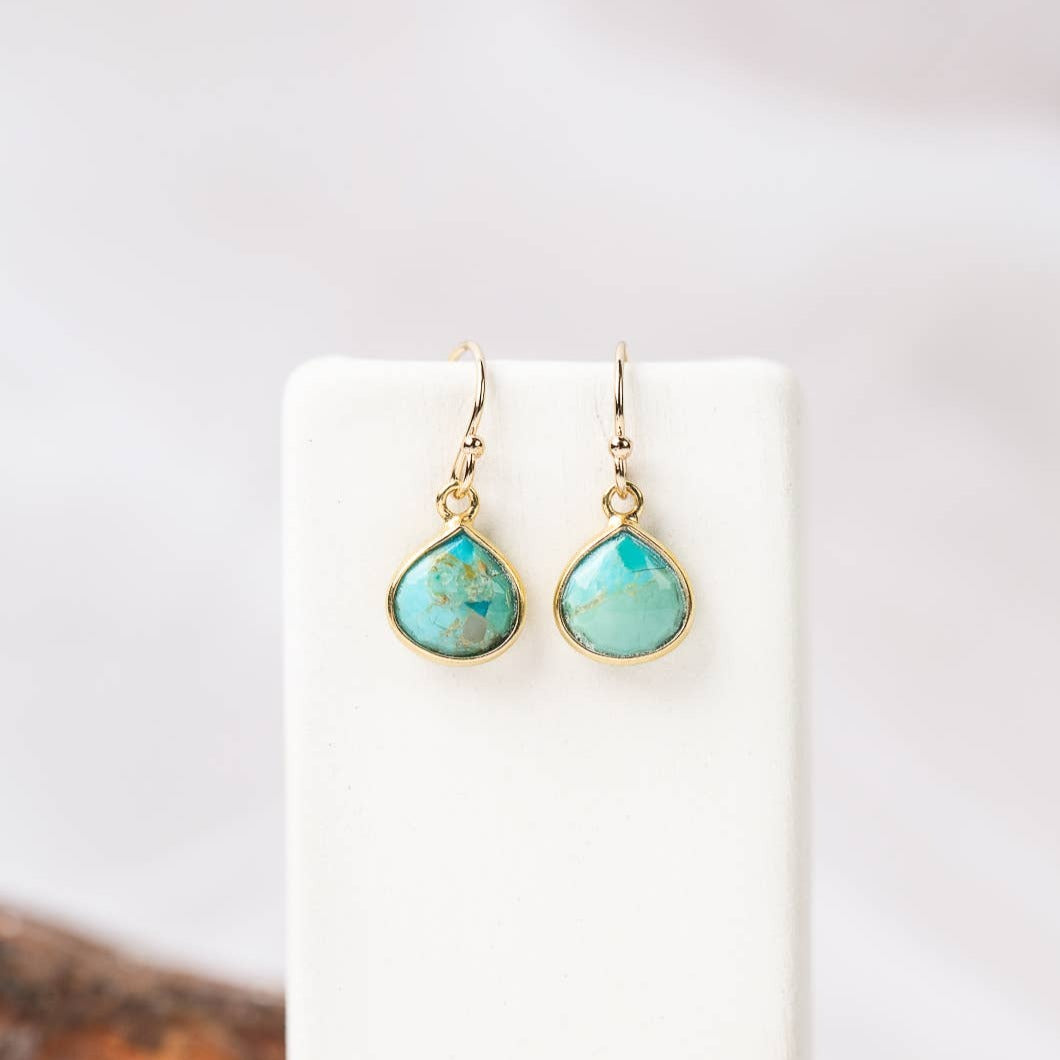 simple gold earrings with a single turquoise stone