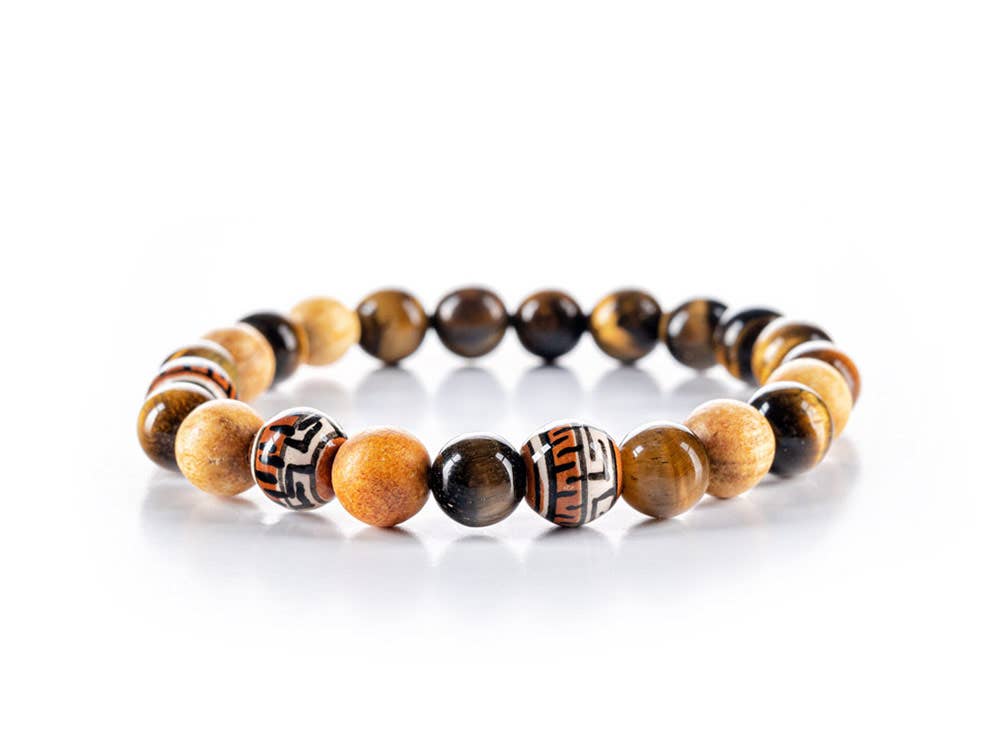 Close-up view of the Tiger’s Eye and Palo Santo Courage Bracelet. The bracelet features Tiger’s Eye beads, known for their courage and integrity, along with Palo Santo beads, known for their energy-cleansing properties.