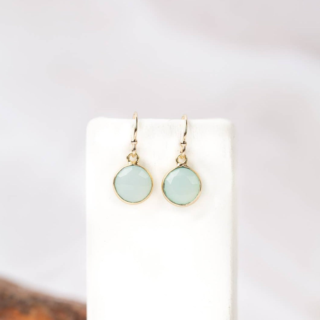 gold earrings with a single chalcedony stone